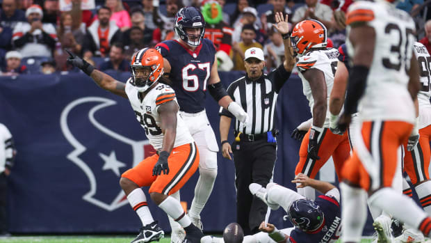 Dec 24, 2023; Houston, Texas, USA; Cleveland Browns defensive end Za'Darius Smith (99) celebrates after sacking Houston Texans quarterback Case Keenum (18) during the second quarter at NRG Stadium. Mandatory Credit: Troy Taormina-USA TODAY Sports  